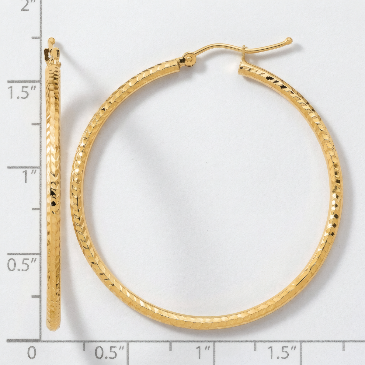 40mm 10k yellow gold diamond-cut hoop earrings, front and side view on a white background with an inch scale.