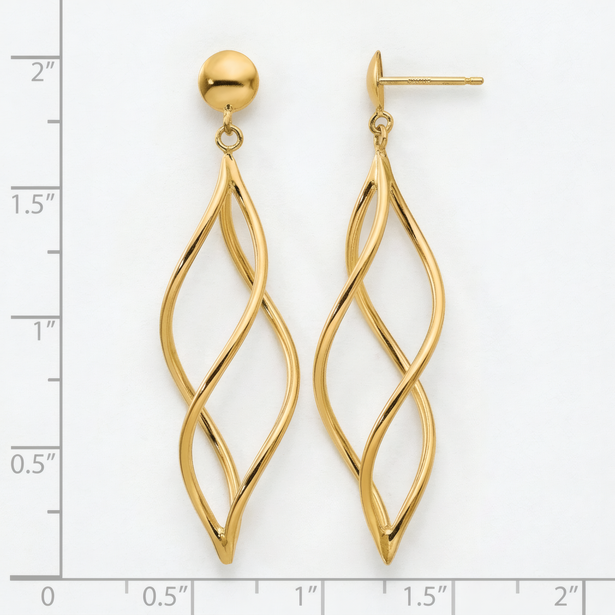 Long open twisted spiral dangle earrings in 10k yellow gold on ball posts, on a white background with an inch scale.
