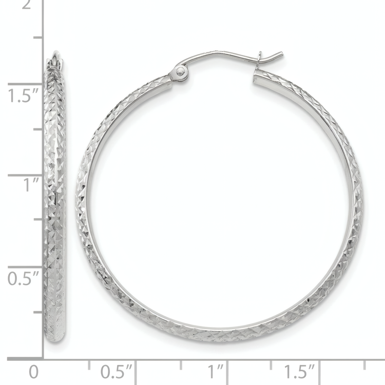 10k white gold diamond-cut hoop earrings, front and side view on a white background with an inch scale.