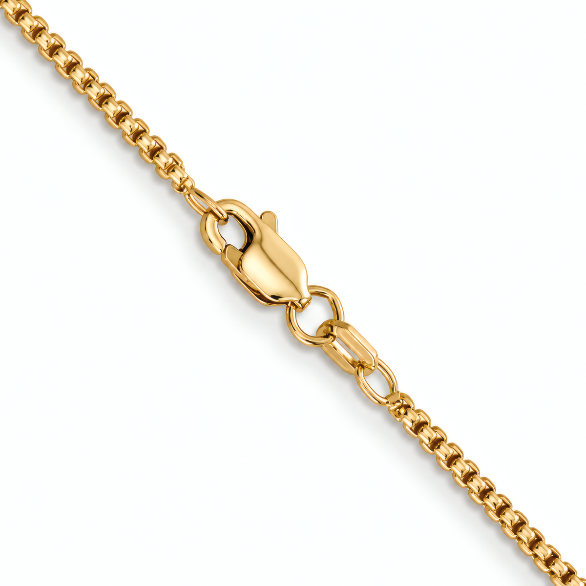 Close-up of the lobster clasp on the 1.5mm 14k yellow gold 16" round box chain.