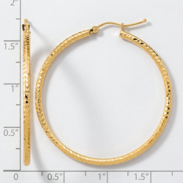 40mm 10k yellow gold diamond-cut hoop earrings, front and side view on a white background with an inch scale.