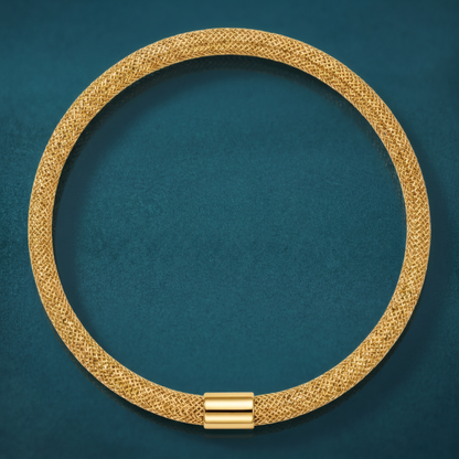4mm 10k yellow gold woven mesh stretch bangle bracelet with a polished barrel accent, on a teal background.