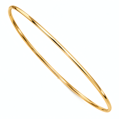 Slim 1.5mm 14k yellow gold bangle bracelet on a white background.