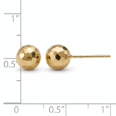 7mm faceted 14k yellow gold ball stud earrings, front and side view on a white background with an inch scale.