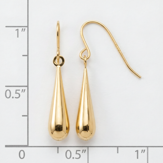 Polished 14k yellow gold teardrop dangle earrings on French hooks, on a white background with an inch scale.