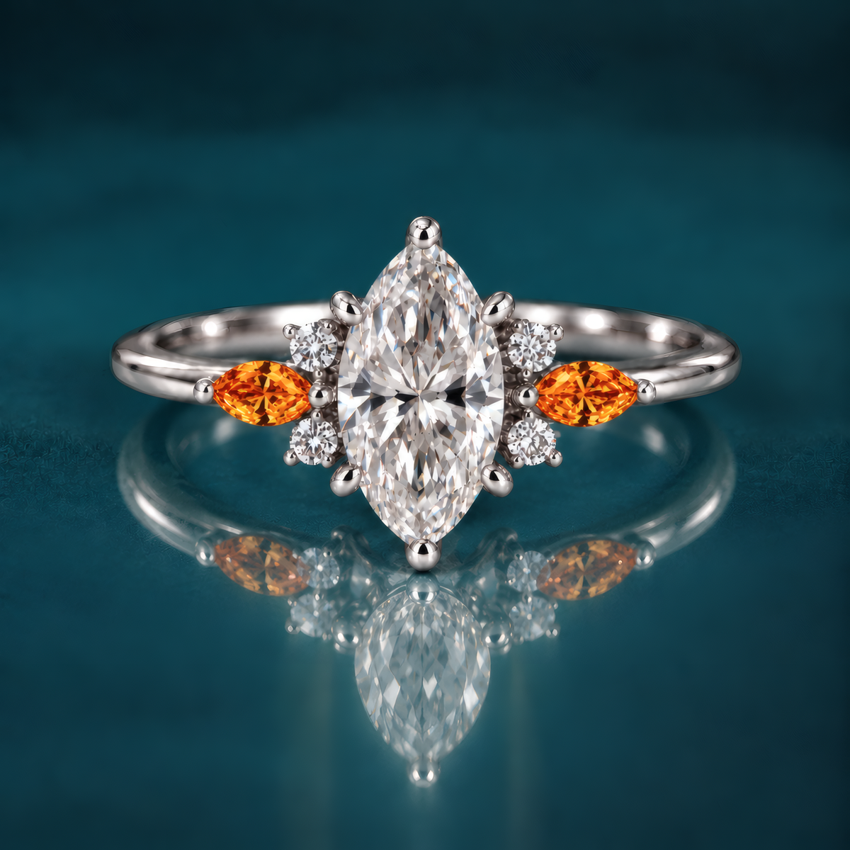 A white gold engagement ring with a striking marquise center diamond, flanked on each side by a fiery amber marquise accent and a cluster of sparkling round diamonds that catch the light like autumn sun. A slender, polished band keeps the look delicate and refined.