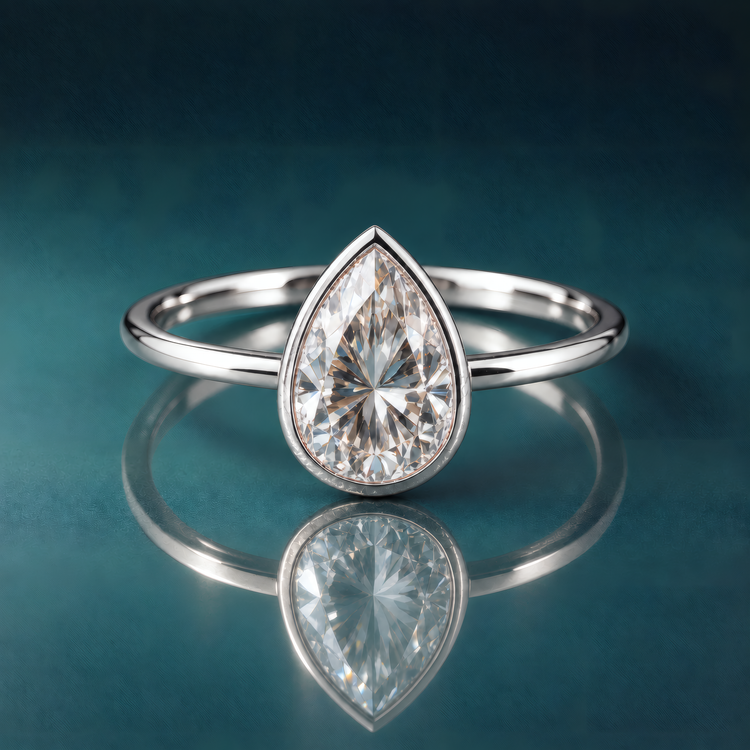 Pear-shaped bezel solitaire engagement ring white gold