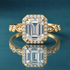 Gold vintage halo engagement ring with milgrain and accent diamonds.