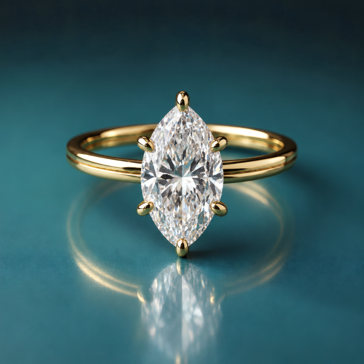 Delicate gold marquise diamond solitaire engagement ring