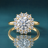 A yellow gold halo ring featuring a large round brilliant-cut center stone surrounded by a halo of smaller round stones.