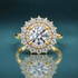 yellow gold double halo engagement ring featuring a round center diamond and a narrow shank.