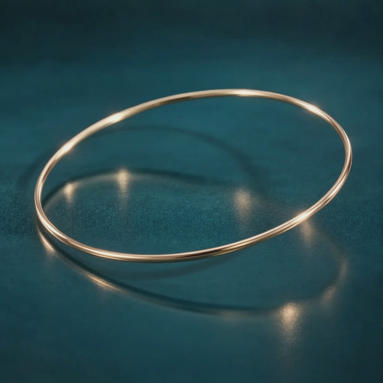 10k gold narrow 1.5mm bangle bracelet delicate stackable gold bracelet