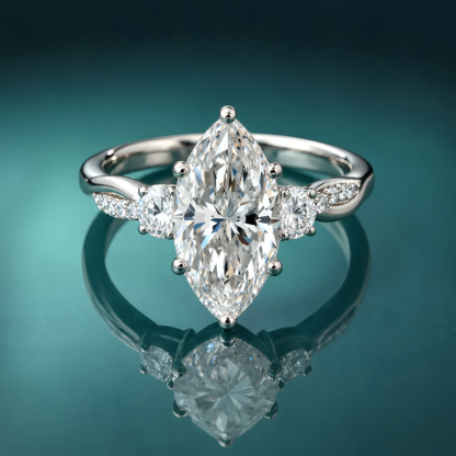 White gold three-stone engagement ring with marquise center diamond and round side diamonds. Twist shank with accent small diamonds.