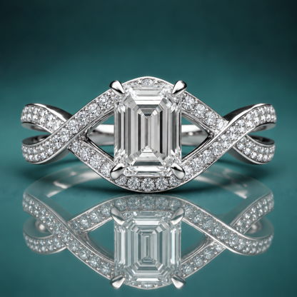 White gold engagement ring with emerald-shaped center stone and a weave-style pave diamond shank.