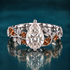Sorrel sets a graceful pear-shaped diamond within a sculpted band of white gold leaves and warm cognac diamonds that curl around the finger like an autumn branch.