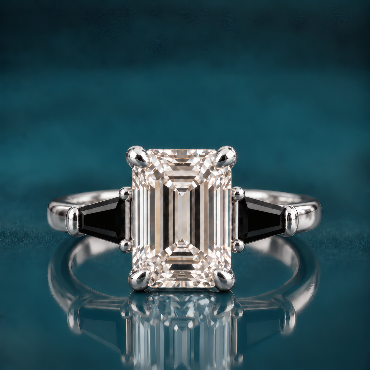 Tavi engagement ring in white gold featuring an emerald-cut diamond flanked by two tapered black baguettes