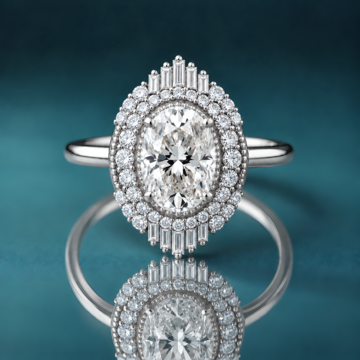 Unique white gold double halo engagement ring with an oval-shaped diamond in the center. Milgrain surrounds the center diamond, then a row of small tapering round diamonds, then another layer of round and baguette-shaped diamonds on the top and bottom of the inner halo. The shank is narrow and shiny.